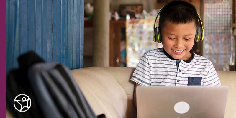 Child working on a lap top computer