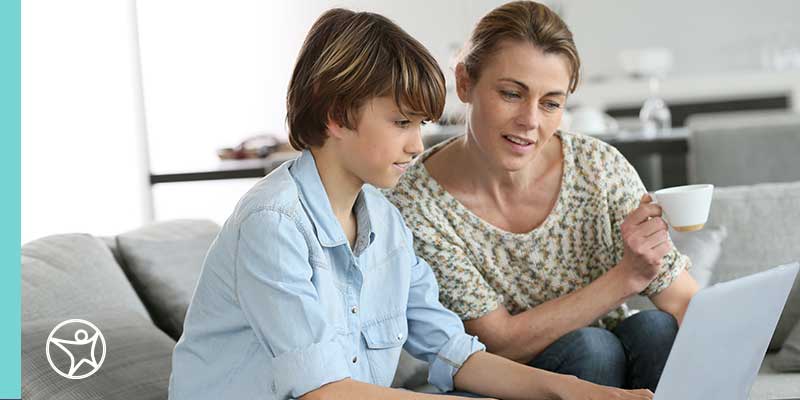 An online school student and parent attending a virtual field trip