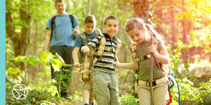 Students playing in the woods