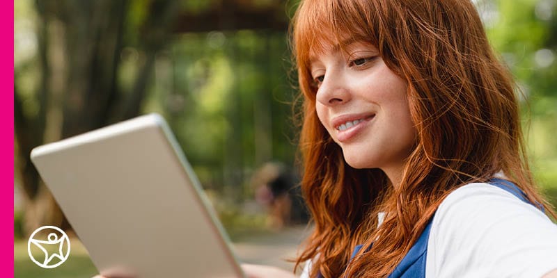 Online summer school student looking at her ipad