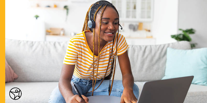 An online student working on homework on her laptop computer.