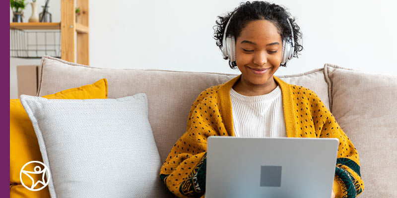 An online student does homework on her laptop.