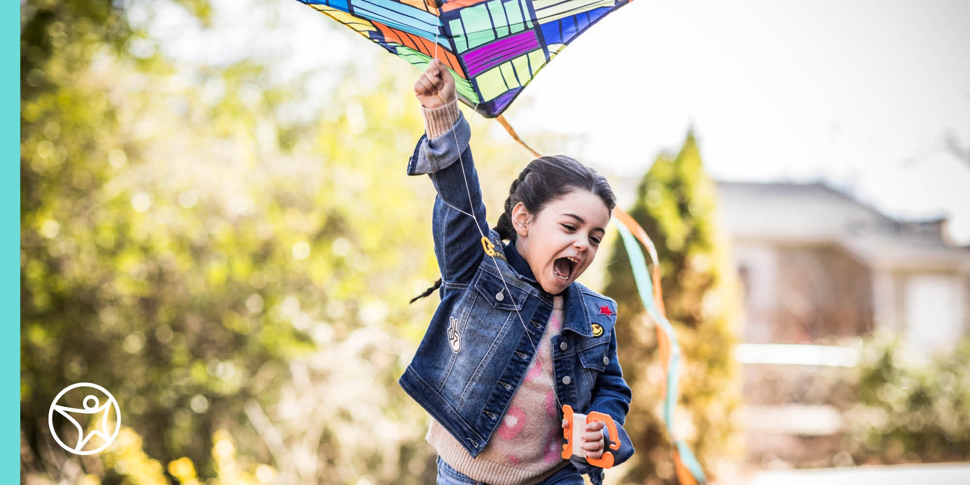A young student flying a kite