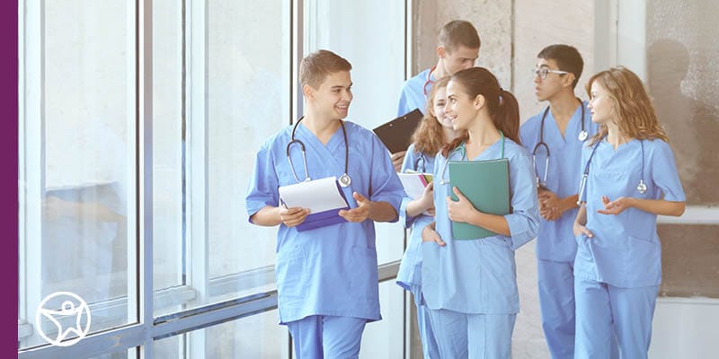 Image of healthcare providers in a hospital hallway