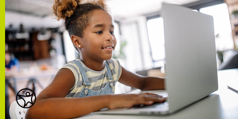 Kindergardener learning at a laptop computer