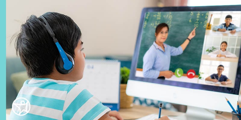An online student watching a virtual presentation