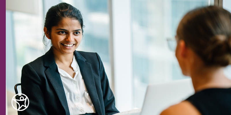 Two women discussing business