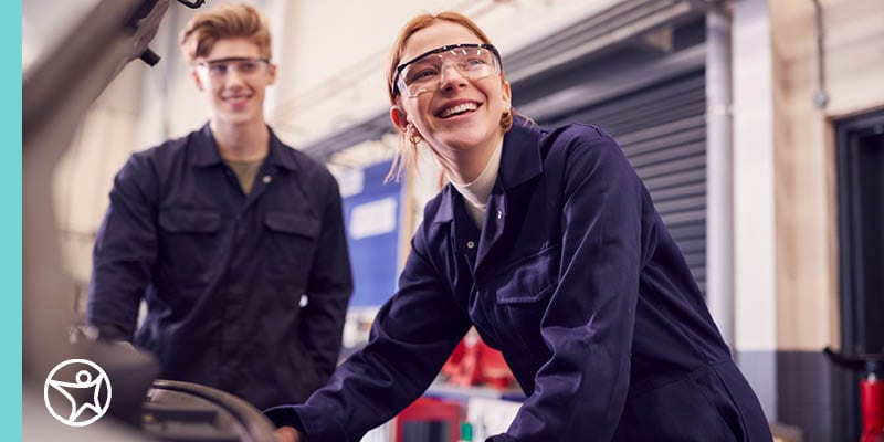 A young man and woman working in a factory