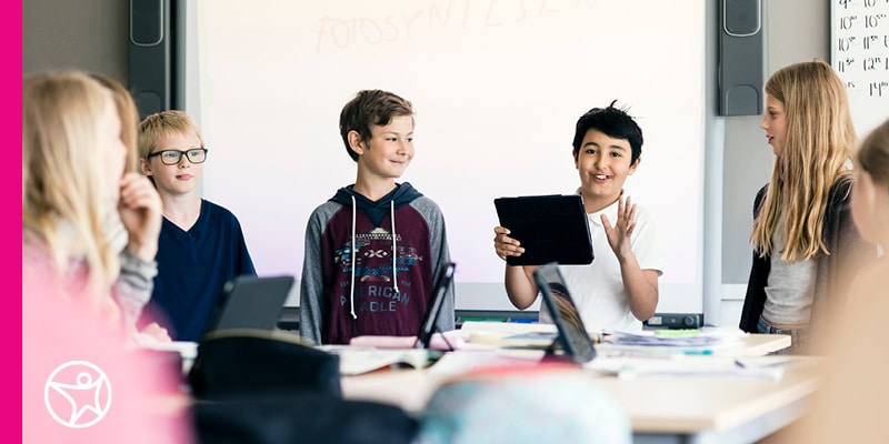 A student demonstrating leadership skills among peers.