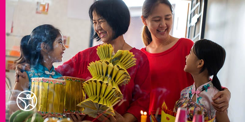 A family celebrating a Chinese holiday.