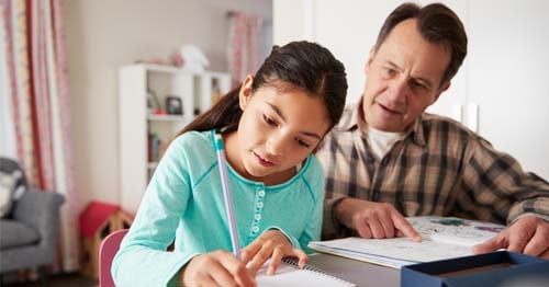 A parent helps coach his gifted student. 