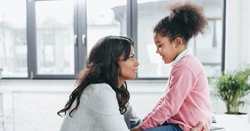 A parent discussing bullying coping strategies with her student.  