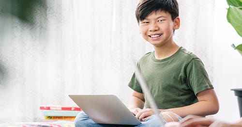 An online school student on a laptop.