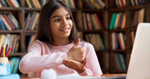 A student participating in an online club to learn a new language. 