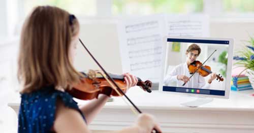 A student learning violin online.  