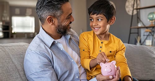 A parent teaching an online student financial literacy.