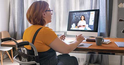 An online student interacting with her teacher. 