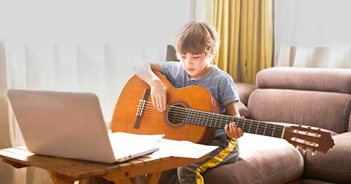 An online student learning to play an instrument.