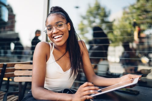 A young woman enjoying the benefits of college prep courses for high school students.