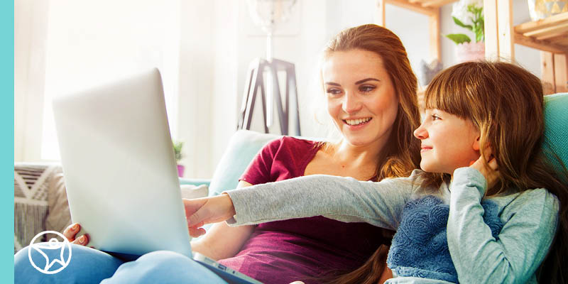 Student and learning coach learning at a laptop computer