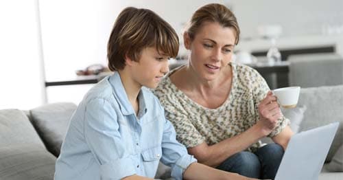 An online student and parent learning about the pros and cons of screen time. 