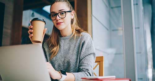 A high schooler enjoying online school benefits such as working at your own pace.