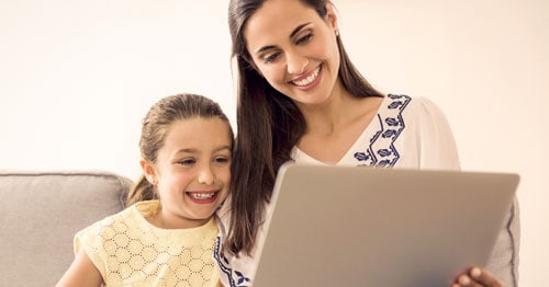 A parent and her online student stay connected with her virtual school teachers.