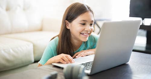 An online student adjusting to virtual school after learning how to change schools. 