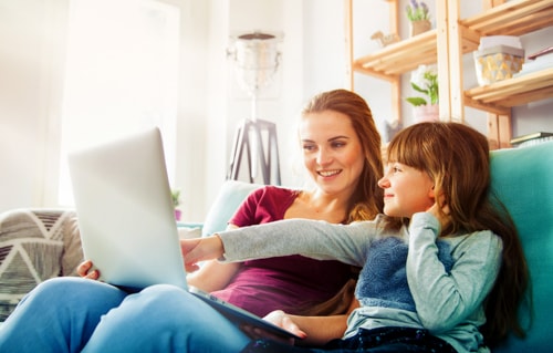 A parent monitors screen time for her elementary student.