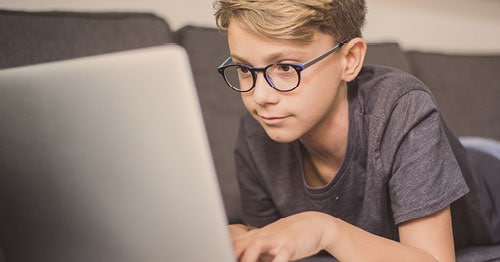 An online student at his computer.  