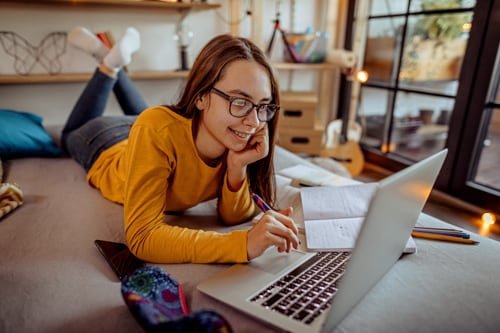 A student on her laptop doing homework.