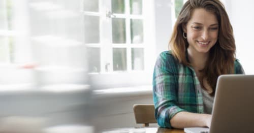 An online high school teacher communicating with her students.