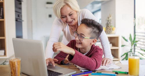 A Learning Coach helps her student complete the daily online school checklist.