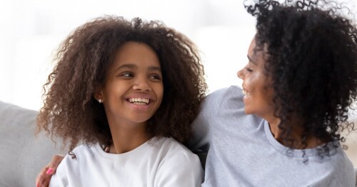 Being a positive example to your children image, a daughter takes encouragement from her mother.