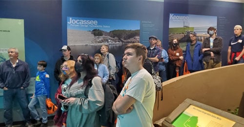 Students gather on an out of school educational field trip together.