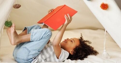 A child reading during the summer. 