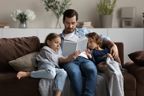 A parent introducing reading strategies to his online students.