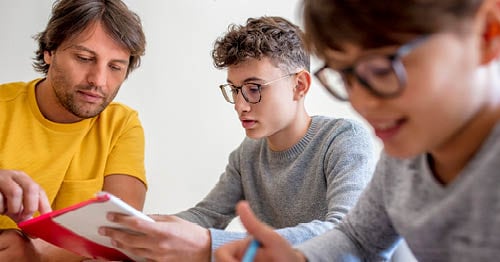 A pair of teens engage in motivation activities for high school students to stay engaged in school.