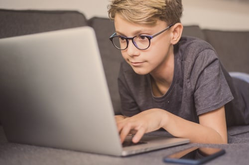 Homeschool student learns computer coding skills. 