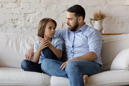 A father and son talking about safety in school.