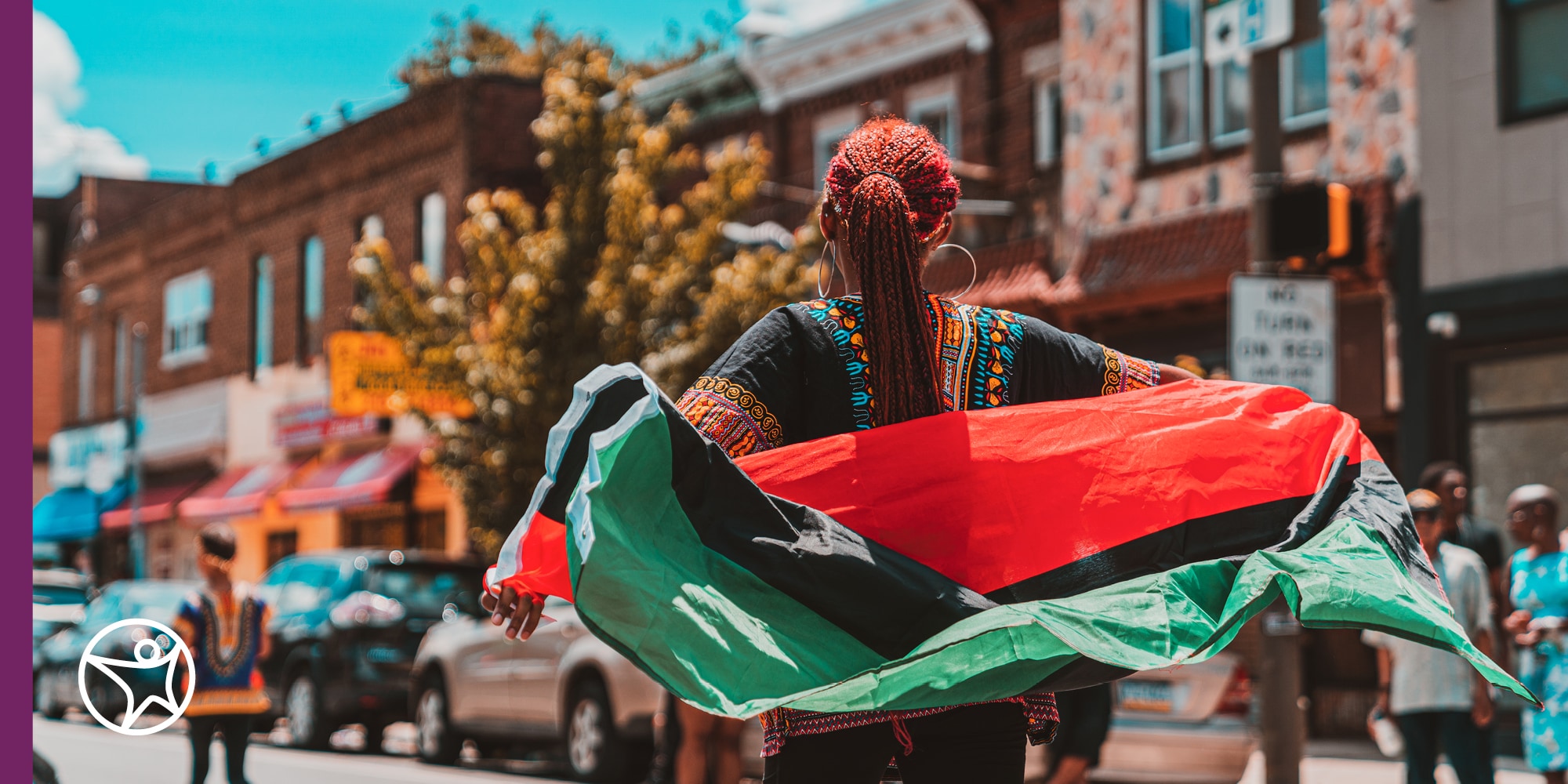 Student holding a pan African flag for Juneteenth celebration