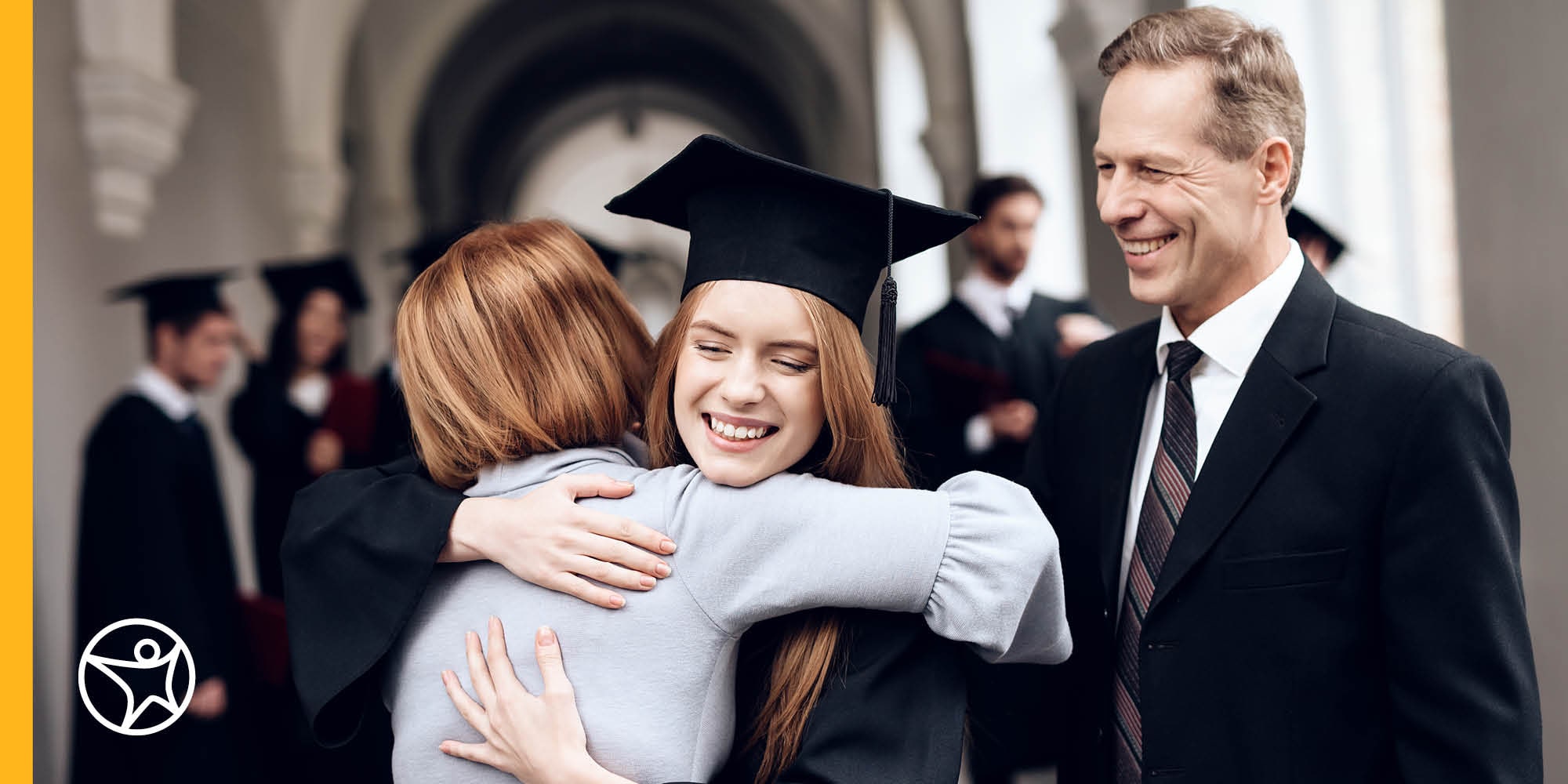 A high school graduate hugging her mom