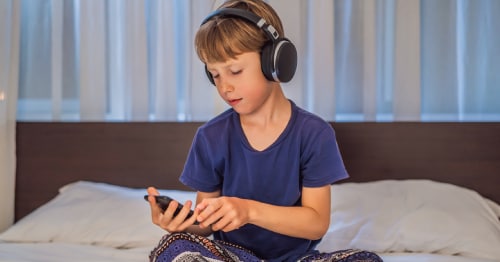 A child using a mindfulness app for kids on a tablet computer