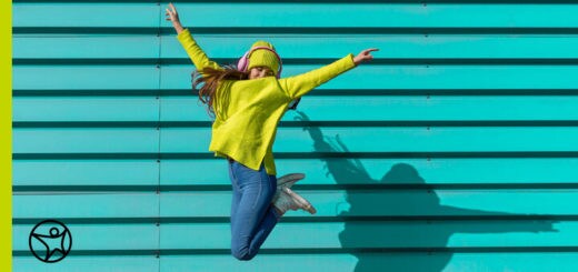 Female student happily jumping in the air - Connections Academy