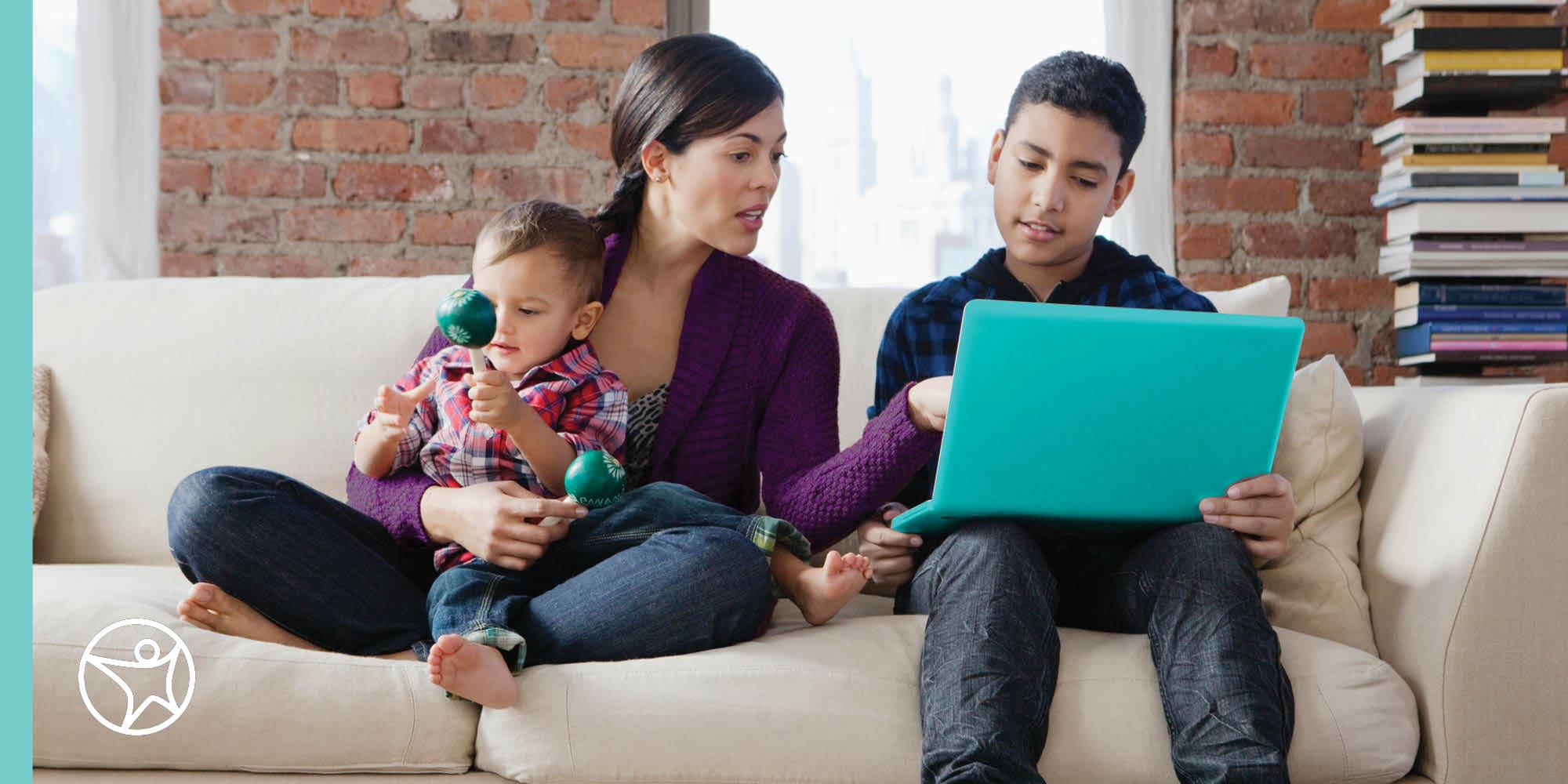 A mother is helping her son with his online classwork