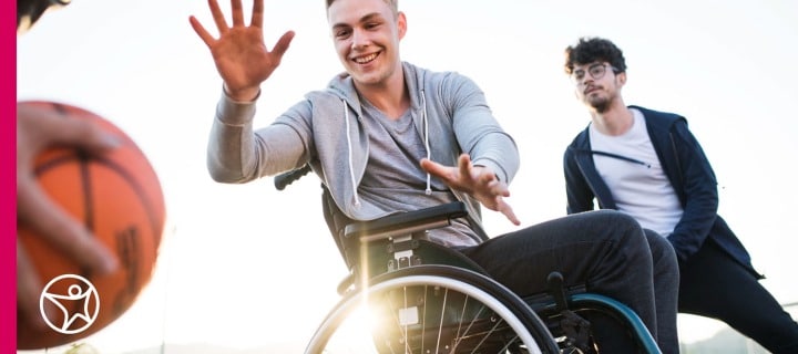 Teenage boys including one in a wheelchair play basketball - Connections Academy