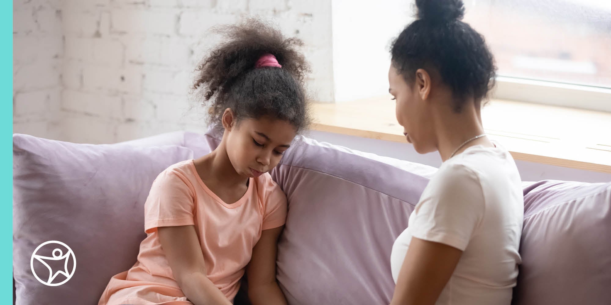 A mom and daughter sitting and having a conversation