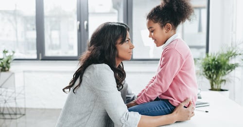 A woman supporting her highly sensitive child.