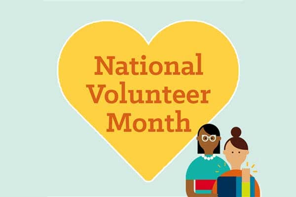 A heart with National Volunteer Month text