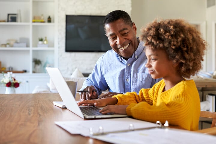 A parent helping his child understand why deadlines are important